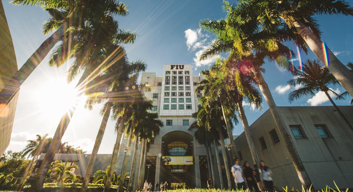 Florida International University campus with palm trees and the FIU building